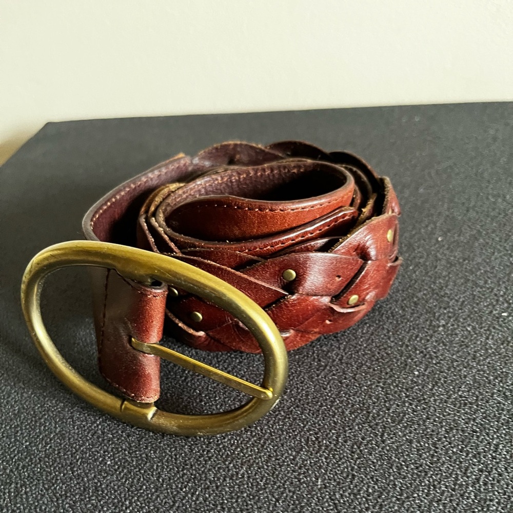 Beautiful brown leather studded belt. Rarely used. Was a size 2 to 8 when worn.